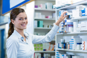 Portrait Of Pharmacist Checking A Medicine In Pharmacy - Resilcon Contabilidade | Escritório de Contabilidade em São Paulo